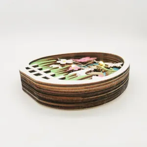 Wooden Easter egg LED decorative ornament featuring multi-layered spring scenery for tabletop.