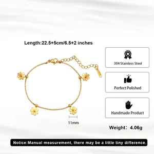 Detailed view of a gold stainless steel bracelet with daisy flower charms and measurements