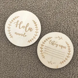 Wooden baby milestone cards detail shot, newborn photography props with cute engraving.