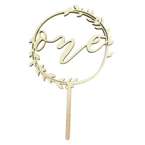 Wooden birthday cake topper with leaf wreath design and cursive one lettering for first party
