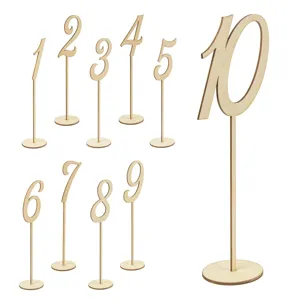 Wooden table number signs set featuring laser-cut digits 1 to 10 with round bases for parties.