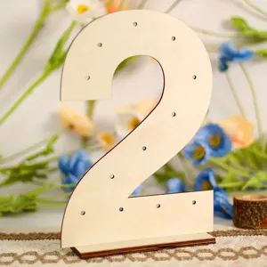 Close up detail of wooden number two donut display stand with multi holes for party decor.