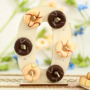 Wooden number zero donut display stand detail, perfect for wedding and birthday party decor.