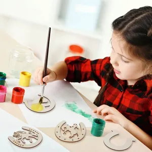 Close-up of DIY unfinished wooden horseshoe crafts with paints, ideal for party decor.
