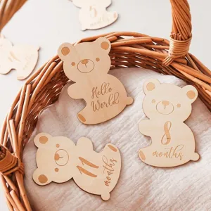 Wooden baby bear milestone disc detail, cute engraved growth month photo prop, natural wood.