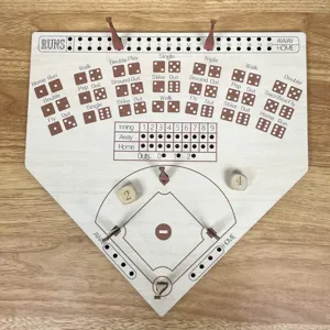 Wooden baseball board game detail showing engraved field layout, dice, and score tracking pegs.