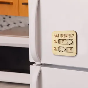 Close-up of wooden pet feeding reminder magnet with sliding indicator for daily pet care.