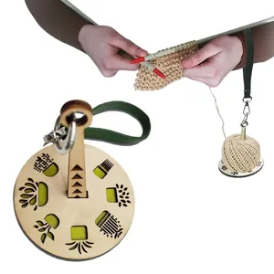 Portable wooden wrist yarn holder with leather strap, ideal for knitting and crochet craft lovers.