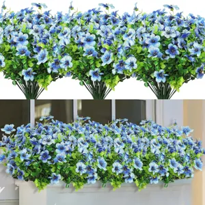 Close up view of artificial blue daisy flowers bouquet and window box decoration details.