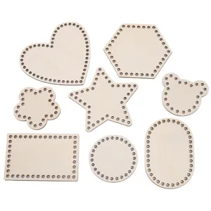 Laser cut wooden bases with pre-drilled holes for crochet basket DIY weaving projects.