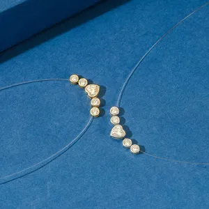 Detail view of 925 silver heart-shaped zirconia pendants on invisible fishing line