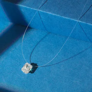 Macro shot of sparkling square zircon pendant on an invisible fishing line necklace