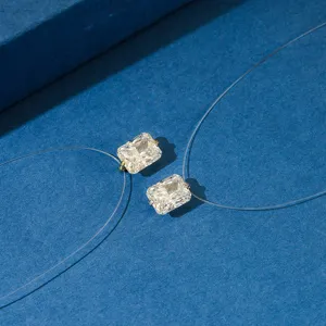 Macro detail of radiant cut square cubic zirconia on minimalist invisible fishing line necklace