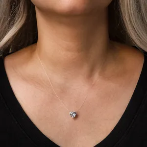 Invisible heart-shaped zirconia pendant necklace on a transparent fishing line choker