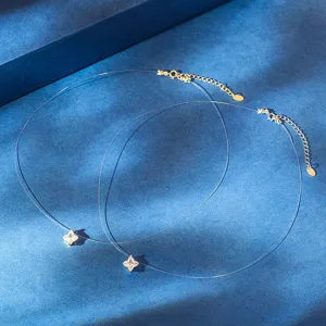 Detail shot of S925 silver mermaid tear necklace with sparkling zircon on blue background.