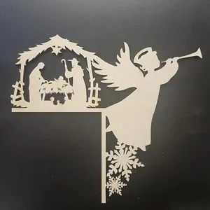 Detail view of wooden Christmas Nativity scene door corner decor with angel and snowflakes.