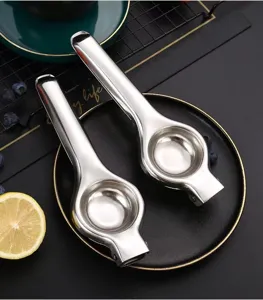 Stainless steel manual lemon squeezer detail, durable kitchen tool for effortless fruit juicing.