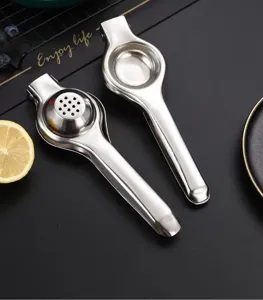 Stainless steel manual lemon squeezer detail, heavy duty citrus press tool for kitchen use.