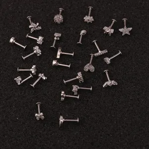 Diverse stainless steel labret stud collection with sparkling zircon flowers and stars