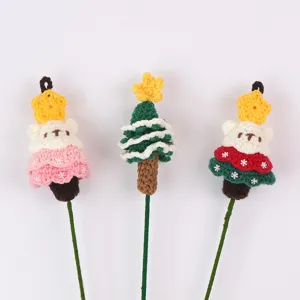 Hand-knitted wool Christmas tree floral picks featuring cute bear and star designs.