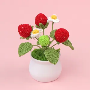Handmade crocheted red strawberry and flower potted plant for desk and home decoration