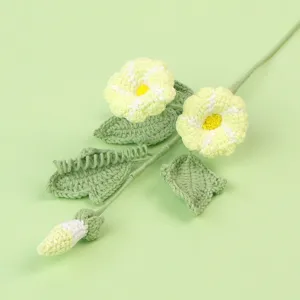 Close-up of handmade crochet morning glory flower with intricate yarn texture