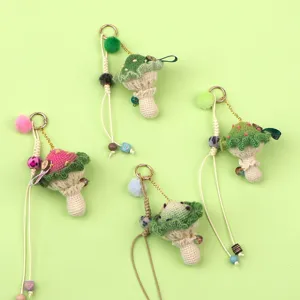 Group display of handmade crochet mushroom keychains with colorful pom-poms and beads