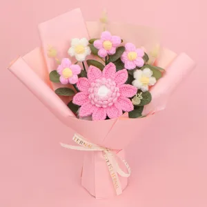 Handmade pink crochet flower bouquet with a decorative 'Love is Eternal' ribbon tie