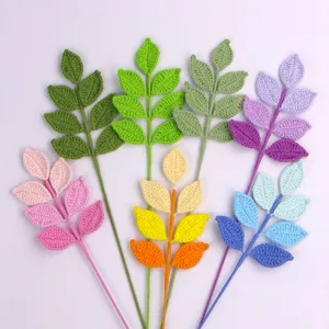 Detailed view of hand-crocheted yarn leaves bouquet with colorful gradient petals for decor.