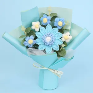 Close-up of a handmade light blue crochet sunflower bouquet with elegant ribbon