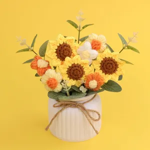 Handmade crochet sunflower and puff flower bouquet in a white textured pot with twine bow