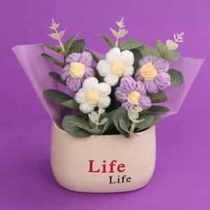 Handmade crochet puff flower potted bouquet with purple and white flowers in a Life pot