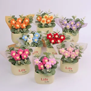 Various colors of handmade crochet puff flower potted plants for desk and home decor