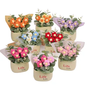 Handmade knitted puff flower potted plants in various vibrant colors for home decor