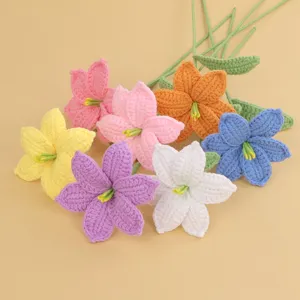 Detail showing the intricate texture of colorful handmade crochet lilies.