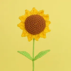 Detailed close-up showing the intricate crochet texture of a handmade yellow sunflower