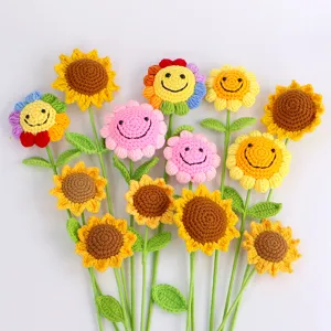 Detailed view of hand-knitted crochet sunflower and rainbow smiling flower bouquet