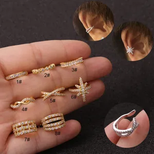 Detailed view of various cubic zirconia cartilage ear cuffs and studs in gold and silver