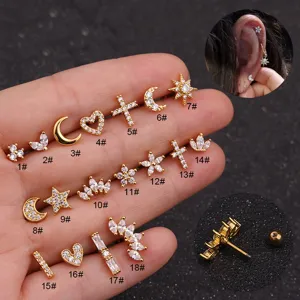 Detailed view of various stainless steel cartilage piercing studs with zircon inlays