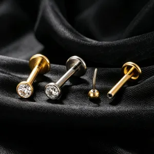Premium G23 F136 titanium labret studs with CZ crystals for cartilage piercing on black silk