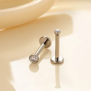 Polished G23 titanium threadless labret studs with clear cubic zirconia tops