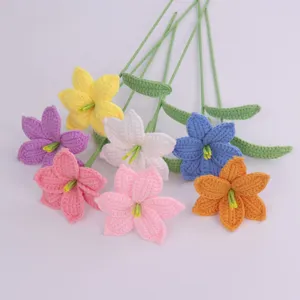 Detailed view of various colorful hand-crocheted wool lilies for home decoration