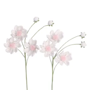 Handmade crochet cosmos flowers in white and pink yarn for unique floral arrangements