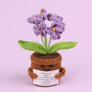 Detailed macro view of a handmade purple crochet flower pot with emotional support card