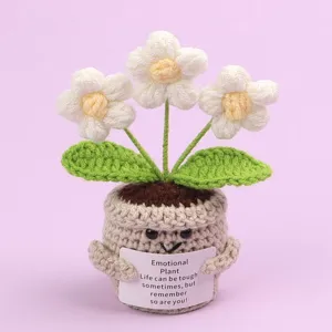 Detail view of a handmade crochet emotional plant featuring a motivational message card