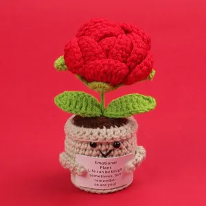 Close-up of handmade crocheted potted rose with inspirational emotional plant message card