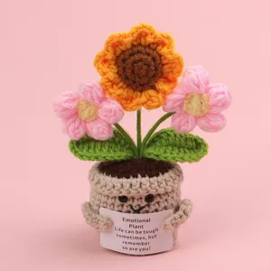Close-up of handmade crochet emotional sunflower plant with encouraging message card