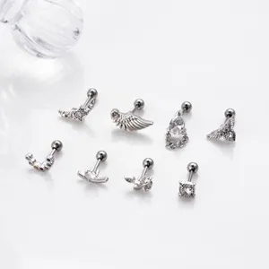 Stainless steel cartilage earring set featuring star wing and cubic zirconia designs