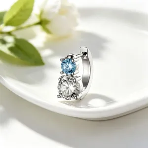 Close-up of 316L stainless steel hoop earring with light blue and clear stacked crystals