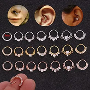 Collection of paved zircon nose and ear piercing rings in silver, gold and rose gold